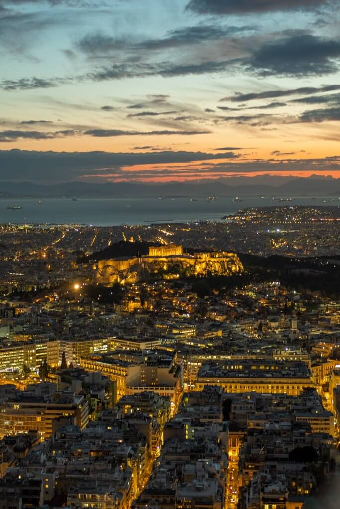 Sunset view from Lykavitos Hill captures the timeless beauty of Athens landmarks, including the Acropolis, in a single, awe-inspiring image. Find this spot using our map of tourist attractions in athens greece