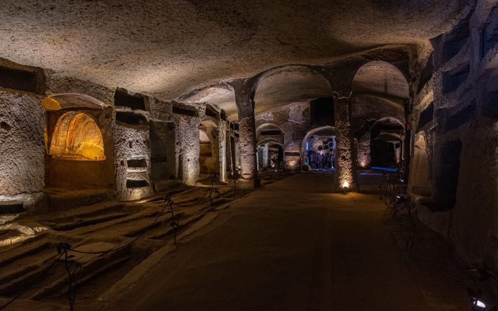 Eerie yet peaceful view inside the San Gaudioso catacombs in Naples.