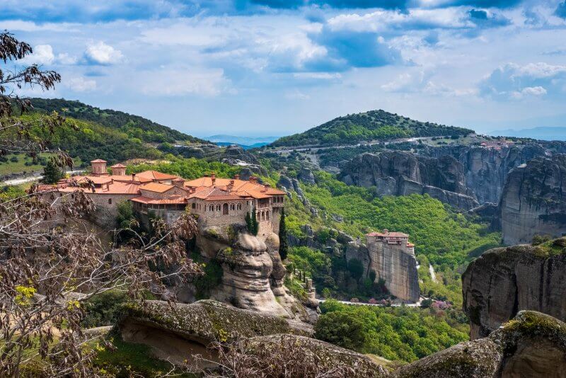 Indulge in the awe-inspiring beauty of Meteora through our spectacular scenic drive picture, featuring the magnificent rock formations and monasteries nestled amidst the mountains. Our image perfectly captures the essence of this UNESCO World Heritage Site, making it an absolute must-visit for every travel aficionado. Brace yourself to be spellbound by the mesmerizing natural wonder of Meteora!