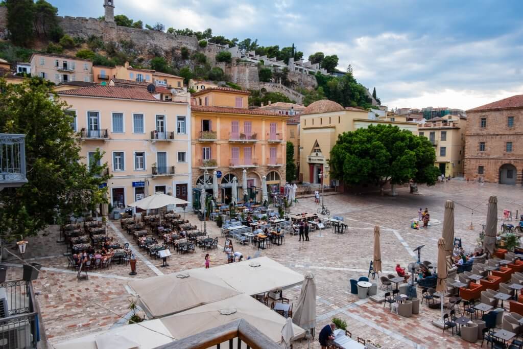 Nafplio old city plaza, a vibrant spot to visit in Nafplio. Geting a hotel there is one of the top things to do in Nafplio Greece